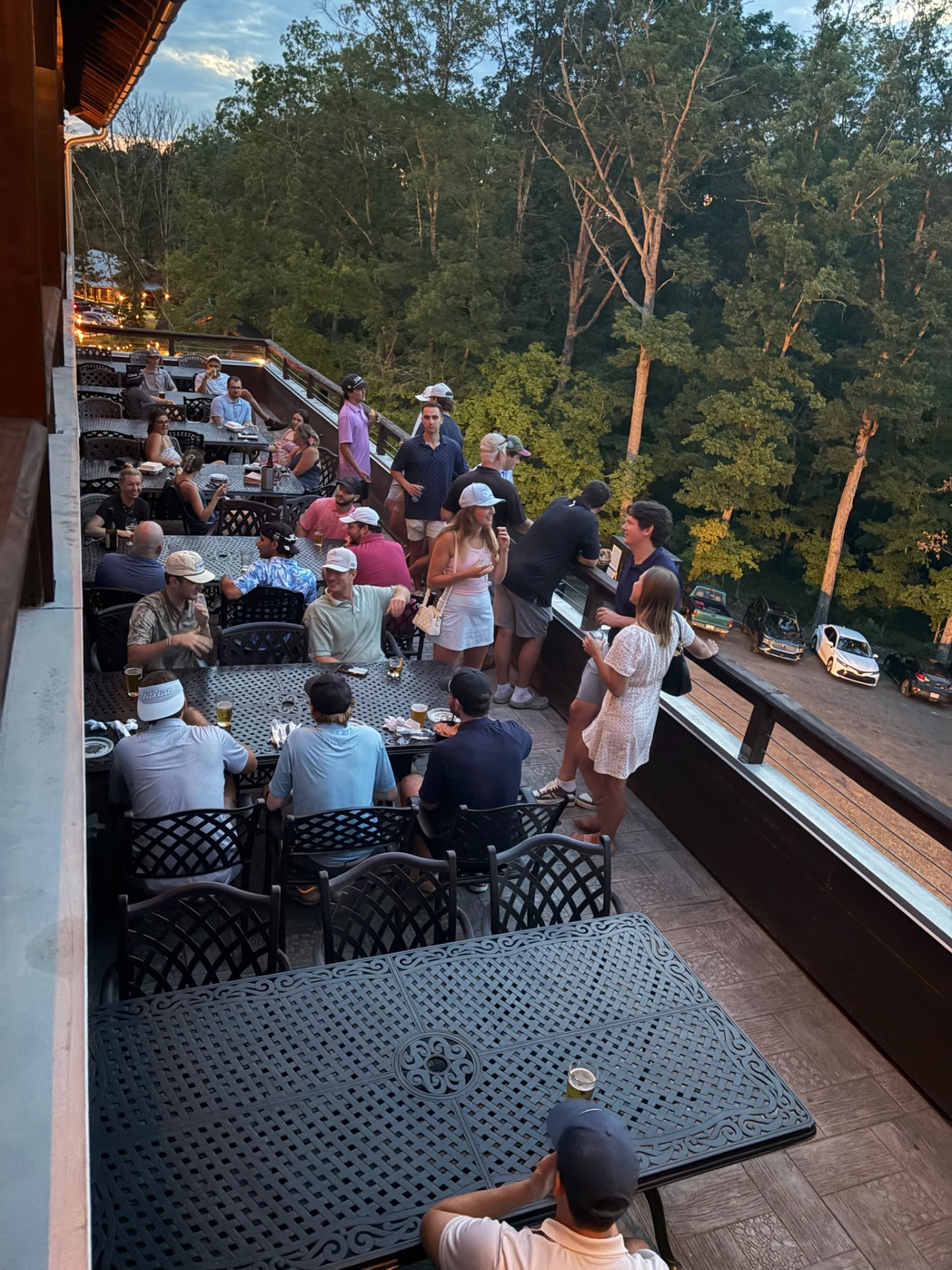Group hanging out on the patio for Friday night Nine and Wine
